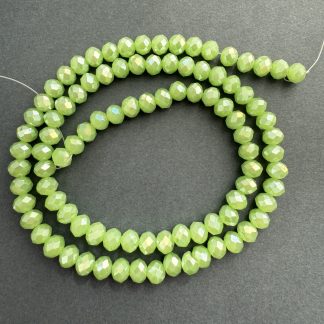 Намистини кришталеві Рондель, розмір 6*4 мм, довжина 38 см, колір салатної-молочний з переливом