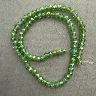 Намистини кришталеві Рондель, розмір 6*4 мм, довжина 38 см, колір салатно-прозорі з переливом