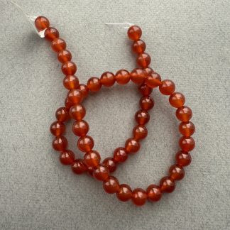 Намистини червоний Агат, форма куля гладка. 
.
Розмір 8 міліметрів, довжина 39 см. 
.
Ціна  за нитку