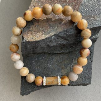 Браслет Крейзі Агат, форма куля гладка з вставкою намистини.
Розмір намистини 9мм, розмір 17см обхвату.
Ціна за шт.