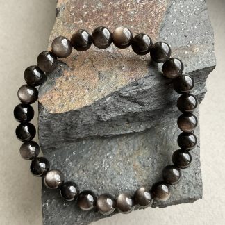 Браслет Сніжний Обсидіан, форма куля гладка .
Розмір намистини 8мм, розмір 17см обхвату.
Ціна за шт.