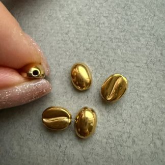 Намистина Кава, ювелірна сталь, відтінок тепле жовте золото. 
.
Розмір 10/7,5 мм , наскрізний отвір
.
Ціна за шт